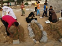 Palestinians in Ghaza mourn on Eid al-Fitr; UN demands ceasefire
