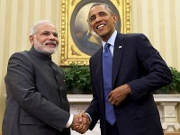 FILE - In this Sept. 30, 2014 file photo, President Barack Obama shakes hands with Indian Prime Minister Narendra Modi in the Oval Office of the White House in Washington. In a show of solidarity, President Barack Obama is flying to India this weekend to be guest of honor at the countryÕs Republic Day festivities. Obama and Modi are trying to move the worldÕs two largest democracies past tensions that have plagued their relationship in recent years. (AP Photo/Evan Vucci, File)