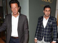 Zulfi Bukhari, right, along with PTI chief Imran Khan in London.