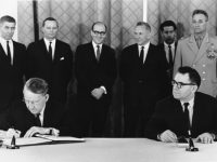 U.S. Ambassador Llewellyn E. Thompson, left, signs nuclear non-proliferation treaty as Soviet Foreign Minister Andrei A. Gromyko watches in Moscow, Russia, on July 1, 1968. Standing, left to right are, Embassy Political Counsellor David Klien, U.S. Embassy Scientific Attache Christopher Squire, U.S. Embassy Political Officer and Chief Translator Alexander Akalovsky, Soviet Premier Alexei N. Kosygin, unidentified Soviet Translator and Soviet Defense Minister Andrei A Grechko.  (AP Photo)