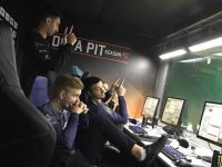 Sumail standing behind his team mates.
