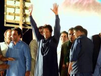 Imran Khan waving to supporters gathered at Parade Ground Islamabad.