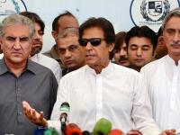 File photo of Imran Khan at a press conference with Shah Mehmood Qureshi (left) and Jahangir Tareen.