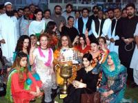 A group of transgender posing for a picture at a the culmination of a sports event in KP.